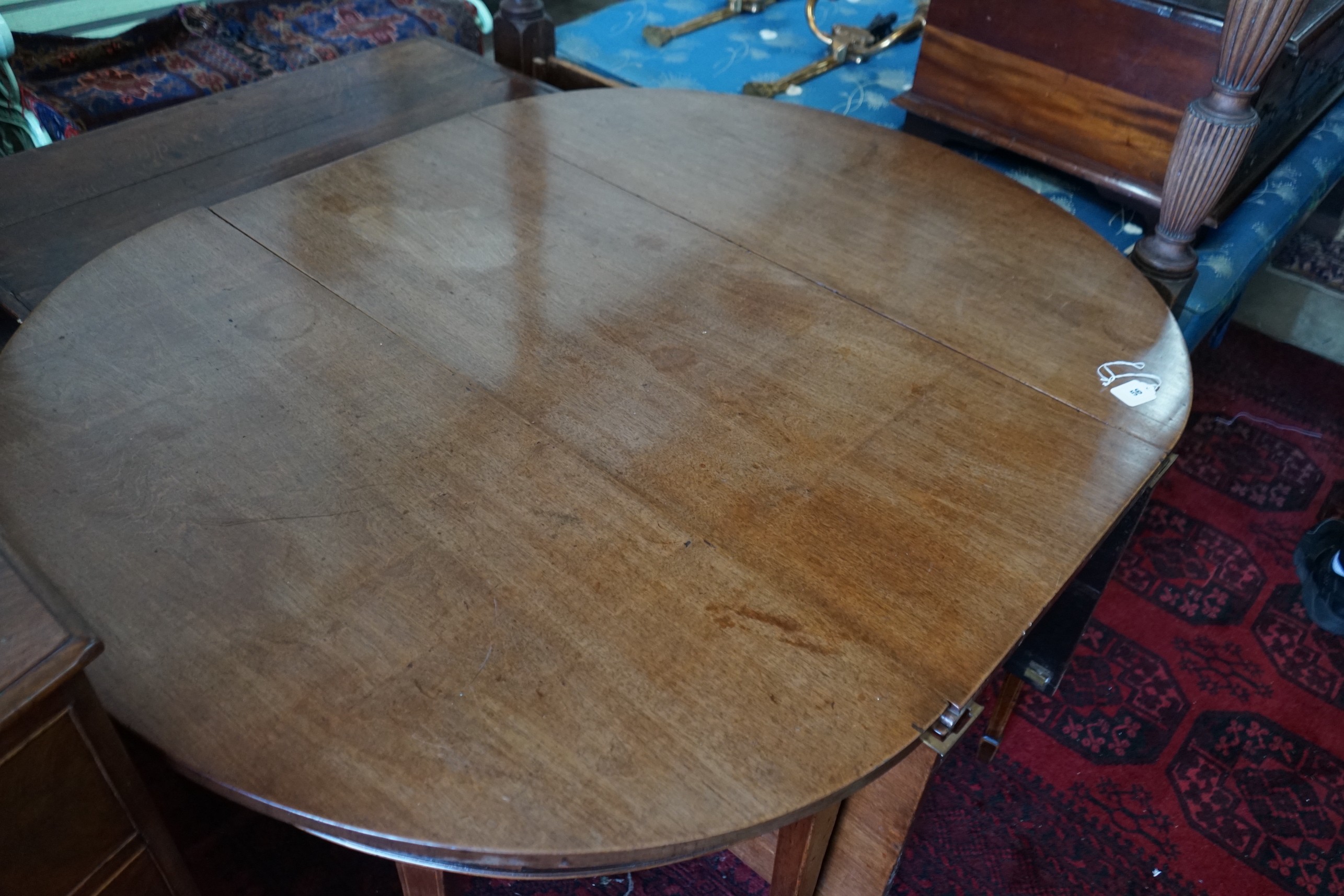 A George III mahogany D-end drop leaf extending dining table, 240cm extended, width 122cm, height 74cm
